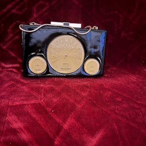 kate spade Photo Finish “(Milo Odometer Clutch")